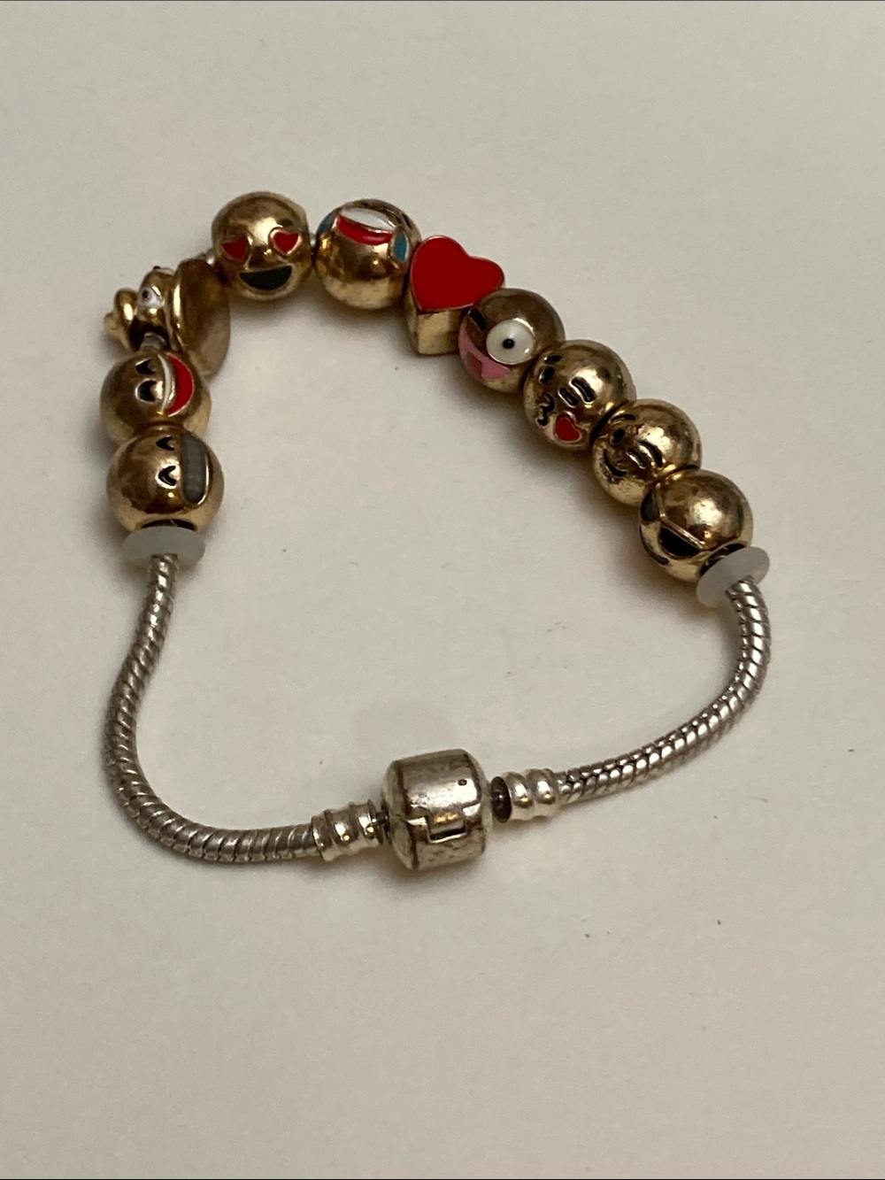 Gold Tone Emoji Bead Charm Bracelet with Red Heart Accent